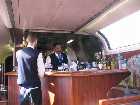 My sleeping car attendant, Donald, goes behind the Pacific Parlour bar as the parlour attendant stands to the left.