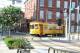 TECO Line streetcar rounds curve at Cadrecha Plaza, near Spaghetti Warehouse.