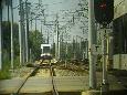 HBLRT Light Rail Vehicle (LRV) from Bayonne to Hoboken Terminal approaches Liberty State Park station, with most of group aboard.