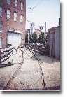 The barn for the Lowell trolley fleet is a corner of the old Boott Cotton Mill building; the bridge passes over one of the city's many canals