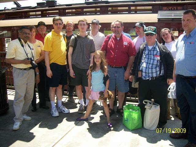 Gang poses in front of Waterfront Red Car streetcar in San Pedro.