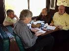 Discussing the next California Rail News.  L to R:  Bill McGeehan, President, Rich Tolmach, Editor (with galley proof) John Tellez and Bob Reynolds