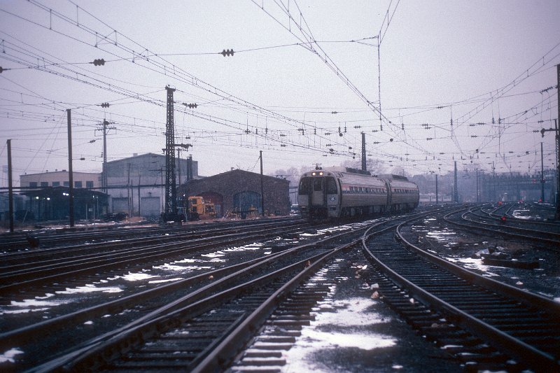 19820543-amtk.jpg - SVP2000 #50 (owned by ConnDOT) and #998 (owned by Amtrak) west of the New Haven station platforms. December 23, 1982.