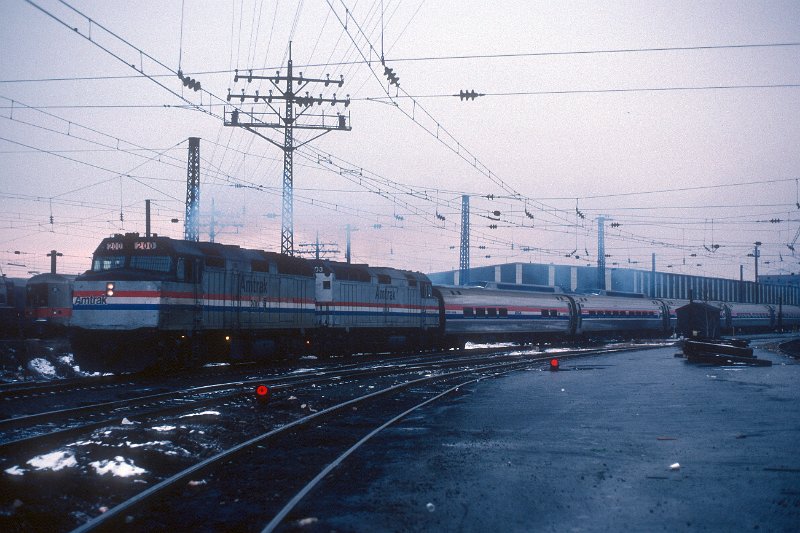 19820538-amtk.jpg - Amtrak train 292 (New England Metroliner) departs New Haven, CT, with F40s #200 and #303. December 23, 1982.