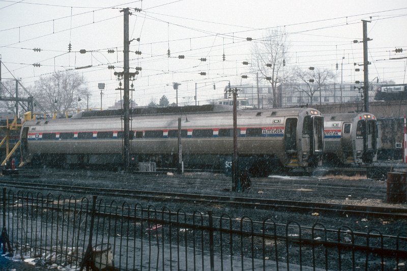 19820546-amtk.jpg - SPV2000 #992 and 993 at New Haven motor storage during a snow squal. December 23, 1982.